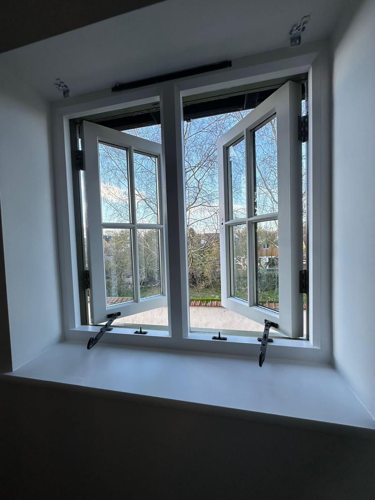 Detail work on interior window frame painting