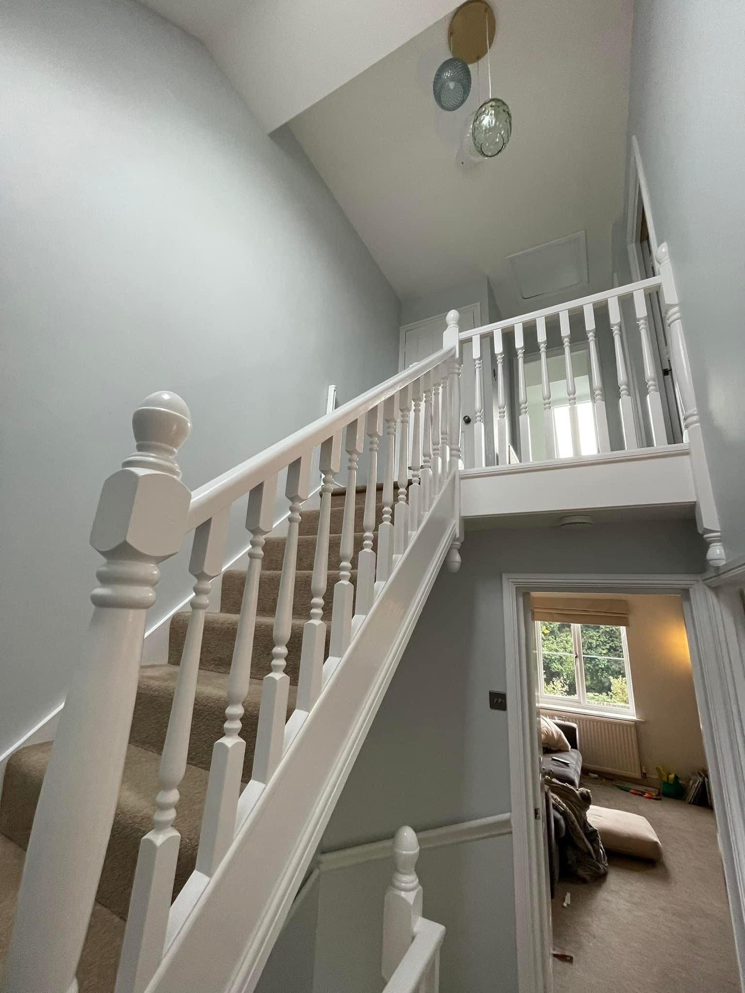 Detailed woodwork and stairway banister painting