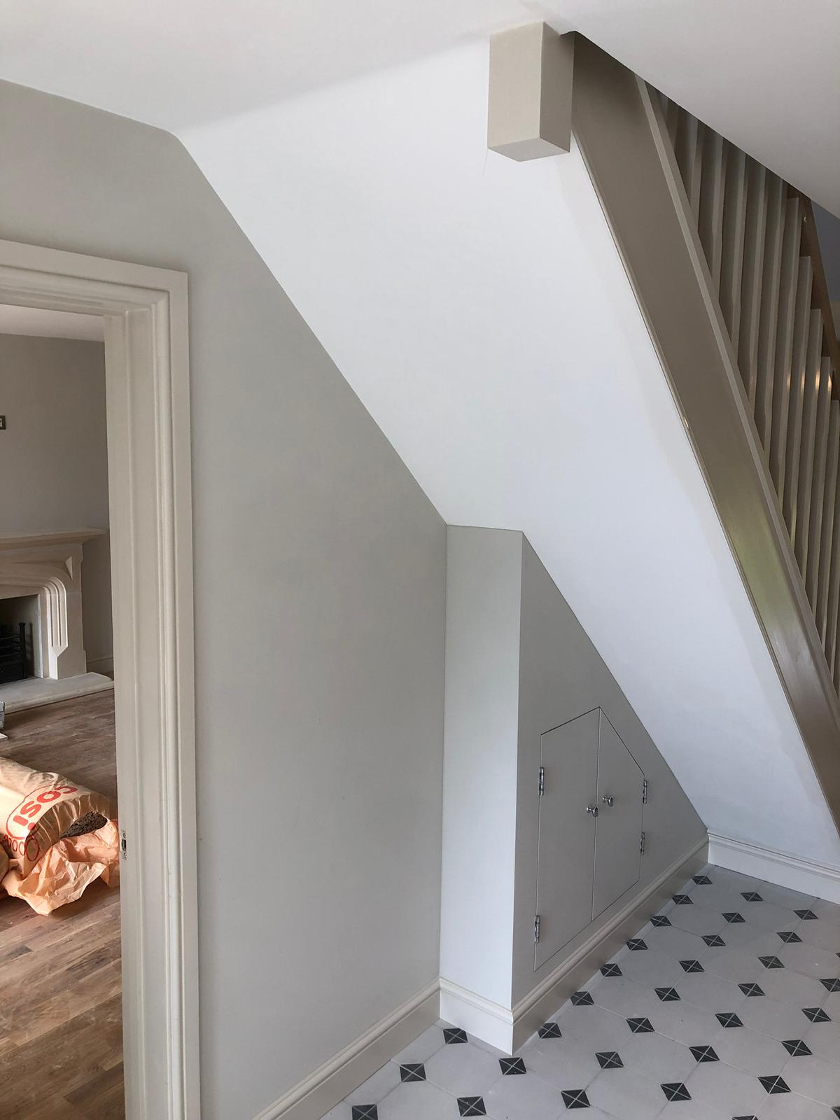 Detailed woodwork painting on stair rails